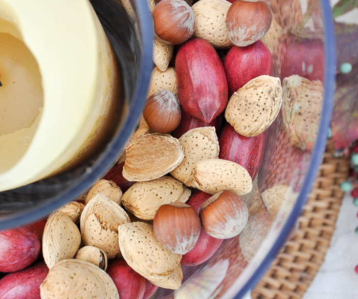 Using whole nuts in your Thanksgiving decor lends an organic feel to your Thanksgiving Table