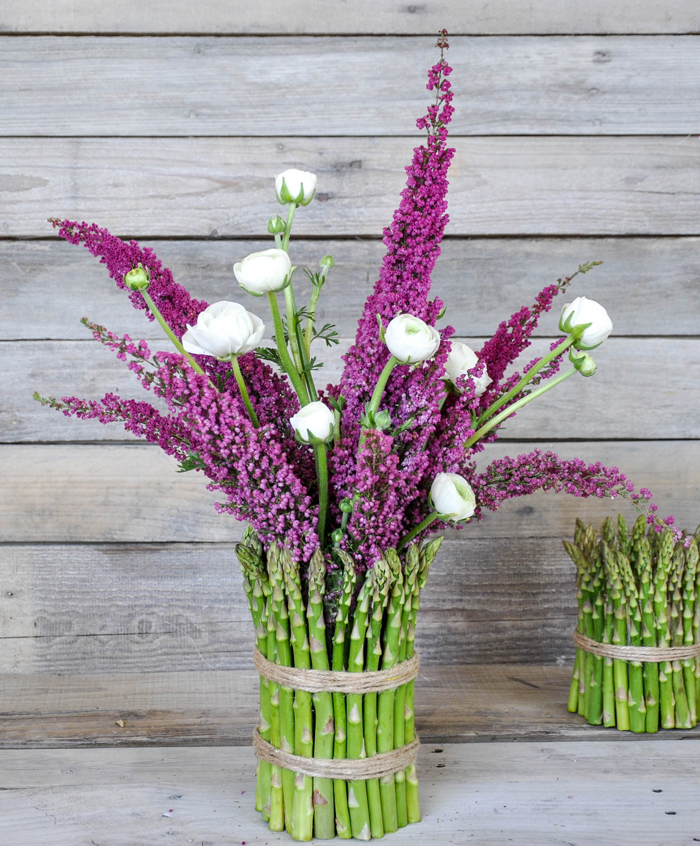 Cover a cylinder vase with fresh asparagus and fill with spring flowers!